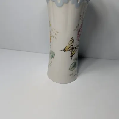 Sale Photo Thumbnail #57: The Lenox Butterfly Meadow vase, designed by artist Louise Le Luyer, is crafted from durable white porcelain and features iconic transferware of vibrant flowers, butterflies, and insects.