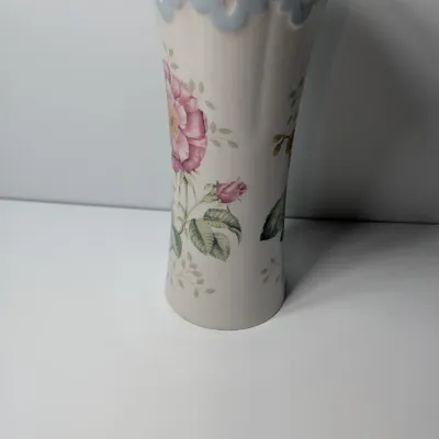 Sale Photo Thumbnail #59: The Lenox Butterfly Meadow vase, designed by artist Louise Le Luyer, is crafted from durable white porcelain and features iconic transferware of vibrant flowers, butterflies, and insects.