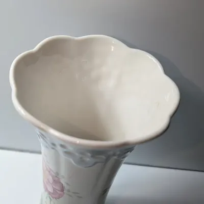Sale Photo Thumbnail #60: The Lenox Butterfly Meadow vase, designed by artist Louise Le Luyer, is crafted from durable white porcelain and features iconic transferware of vibrant flowers, butterflies, and insects.