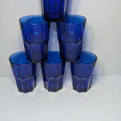 Sale Photo Thumbnail #178: The Libbey DuraTuff Gibraltar Dusky Blue 16oz Cooler Glasses are highly sought-after, discontinued pieces that bridge the gap between mid-century modern style and durable late-20th-century craftsmanship. While the classic paneled Gibraltar design dates ba
