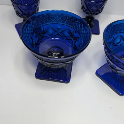 Sale Photo Thumbnail #185: The Pair of Vintage Cape Cod Cobalt Blue Glass Low Sherbet Cups by Imperial Glass (Pattern 160) measure approximately 3.25" tall and 3.5" to 3.625" in diameter

Cobalt stemware and blue glassware add a striking jewel-toned elegance to any table
5 cobalt s