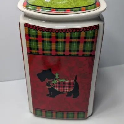 Sale Photo Thumbnail #156: The Christmas Scotty collection by 222 Fifth (PTS) is a highly sought-after holiday dinnerware line featuring a classic Scottish Terrier wearing an argyle sweater, set against a vibrant green, red, and yellow plaid backdrop. Because this specific holiday 