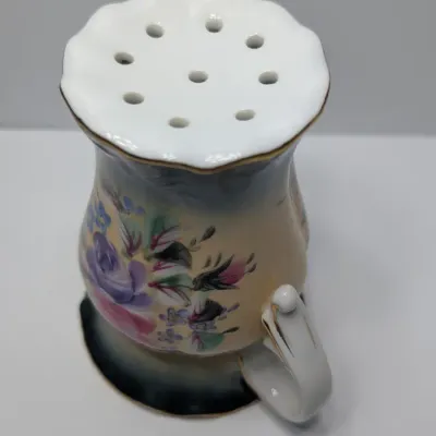 Sale Photo Thumbnail #97: Vintage 5-inch hand-painted Nippon porcelain hat pin holders, featuring classic floral motifs and gold trim, typically date between 1891 and 1921