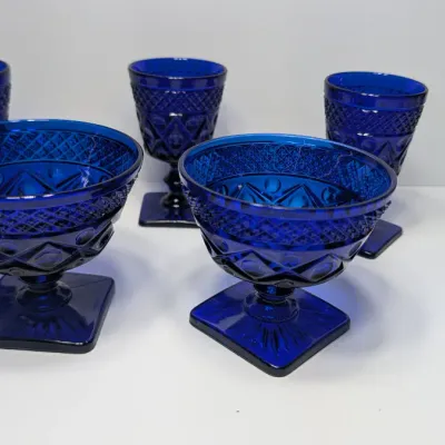 Sale Photo Thumbnail #187: The Pair of Vintage Cape Cod Cobalt Blue Glass Low Sherbet Cups by Imperial Glass (Pattern 160) measure approximately 3.25" tall and 3.5" to 3.625" in diameter

Cobalt stemware and blue glassware add a striking jewel-toned elegance to any table
5 cobalt s