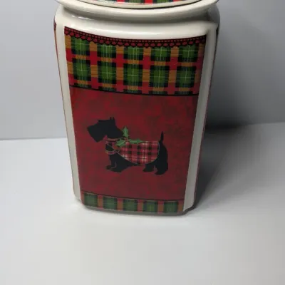 Sale Photo Thumbnail #158: The Christmas Scotty collection by 222 Fifth (PTS) is a highly sought-after holiday dinnerware line featuring a classic Scottish Terrier wearing an argyle sweater, set against a vibrant green, red, and yellow plaid backdrop. Because this specific holiday 