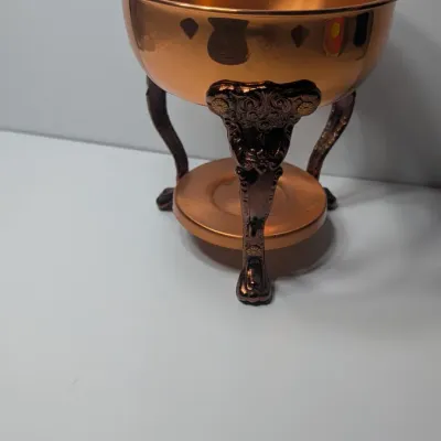 Sale Photo Thumbnail #4: The vintage Princess House copper and brass coffee carafe with stand is a popular 1960s and 1970s mid-century piece designed for elegant tabletop coffee or tea service