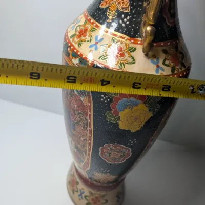 Sale Photo Thumbnail #43: Approx 15 1/2" tall - Vintage hand-painted Oriental vases with gold handles typically feature Japanese Satsuma-style, intricate Chinoiserie floral motifs, or traditional Chinese court scenes