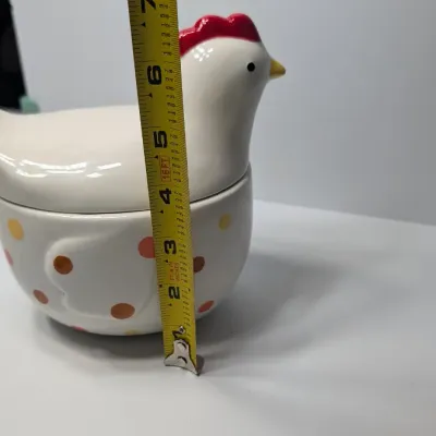 Sale Photo Thumbnail #145: The TAG (often sold as Tag Kitchen) Polka Dot Chicken Covered Nesting Candy Dishes feature a whimsical, dual-compartment design. Made of ceramic, these brightly colored lidded bowls measure roughly 5 inches long and 6.5 inches tall, making them ideal coun
