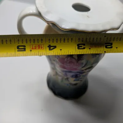 Sale Photo Thumbnail #99: Vintage 5-inch hand-painted Nippon porcelain hat pin holders, featuring classic floral motifs and gold trim, typically date between 1891 and 1921