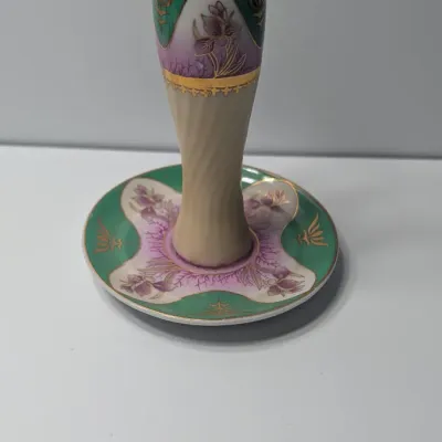 Sale Photo Thumbnail #70: The Limoges Porcelain Gold Gilded 10-Hole Hat Pin Holder is a highly collectible vintage vanity piece. Typically crafted between the late 1800s and the 1920s—the height of the Victorian and Edwardian hatpin era—these hand-painted porcelain holders fea