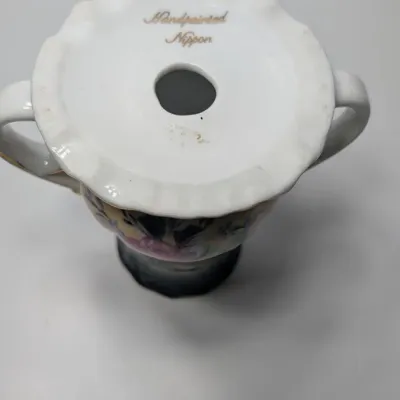 Sale Photo Thumbnail #98: Vintage 5-inch hand-painted Nippon porcelain hat pin holders, featuring classic floral motifs and gold trim, typically date between 1891 and 1921