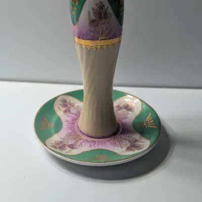 Sale Photo Thumbnail #69: The Limoges Porcelain Gold Gilded 10-Hole Hat Pin Holder is a highly collectible vintage vanity piece. Typically crafted between the late 1800s and the 1920s—the height of the Victorian and Edwardian hatpin era—these hand-painted porcelain holders fea