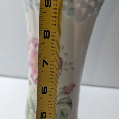 Sale Photo Thumbnail #62: The Lenox Butterfly Meadow vase, designed by artist Louise Le Luyer, is crafted from durable white porcelain and features iconic transferware of vibrant flowers, butterflies, and insects.
