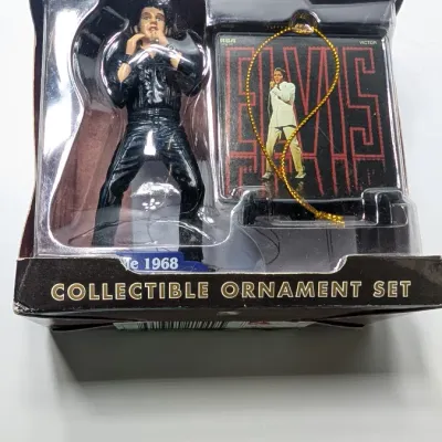 Sale Photo Thumbnail #219: Boxes have damage 

Nostalgic 4-inch pieces frequently feature Elvis in his iconic Aloha shirt strumming a ukulele,


4-inch figure produced by Trevco in 2002. It features Elvis in his iconic black leather outfit from the famous '68 Comeback SpecialThe El