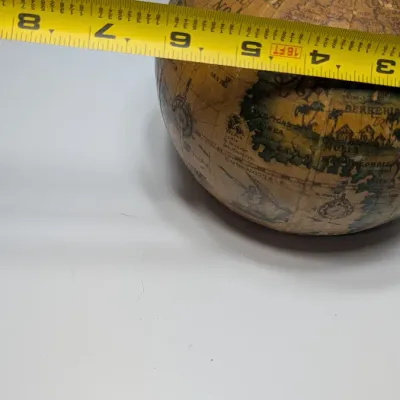 Sale Photo Thumbnail #31: Vintage 1960s leather-wrapped world map bottles are iconic mid-century barware collectibles. Most were handcrafted in Italy (particularly Florence) as decorative decanters for wine or liquor

Materials: Green or brown glass bottles encased in genuine, hea