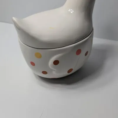 Sale Photo Thumbnail #141: The TAG (often sold as Tag Kitchen) Polka Dot Chicken Covered Nesting Candy Dishes feature a whimsical, dual-compartment design. Made of ceramic, these brightly colored lidded bowls measure roughly 5 inches long and 6.5 inches tall, making them ideal coun