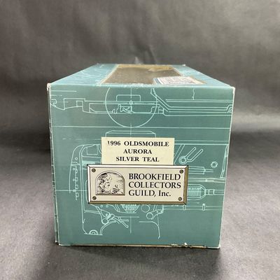 -100- 1:24 SCALE | 1996 Oldsmobile Aurora Silver Teal