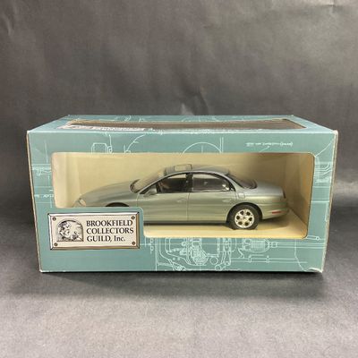 -100- 1:24 SCALE | 1996 Oldsmobile Aurora Silver Teal