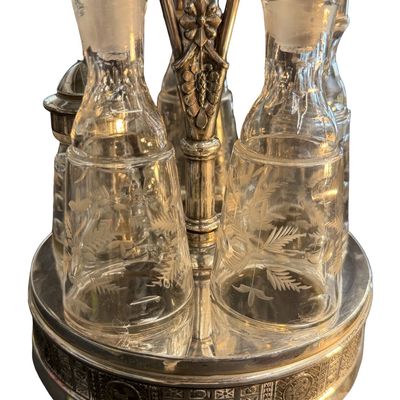Antique Victorian Silver-Plated Condiment or Cruet Set featuring an Ornate Pedestal Stand with a Central Handle and Matching Glass Bottles