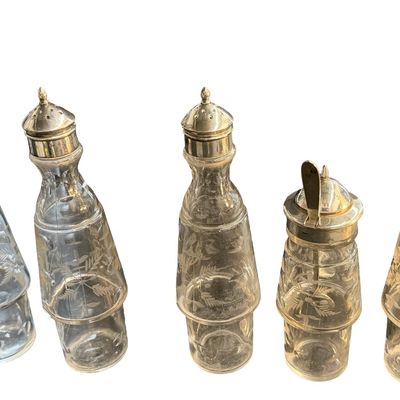 Antique Victorian Silver-Plated Condiment or Cruet Set featuring an Ornate Pedestal Stand with a Central Handle and Matching Glass Bottles