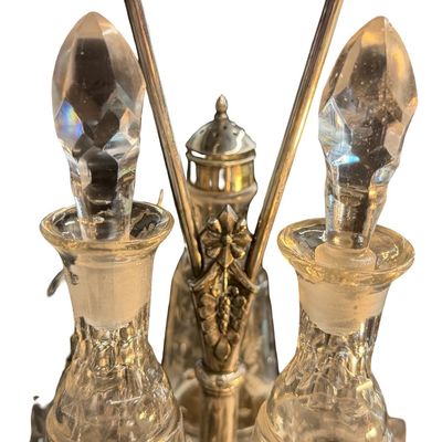 Antique Victorian Silver-Plated Condiment or Cruet Set featuring an Ornate Pedestal Stand with a Central Handle and Matching Glass Bottles