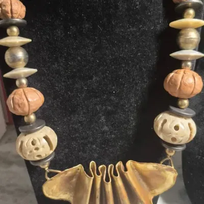 Sale Photo Thumbnail #358: Tribal Bohemian artisans Necklace with copper pleated fan



Bold statement, easy to wear not overpowering heavy



Pleated fan is the center point......16" overall