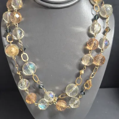 Sale Photo Thumbnail #275: Pair VTG. Aurora Borealis Necklace & Frosted round glass bead [ 2 PCs. ]
> Aurora Borealis beads with gold caps both sides, knotted......22" 
> Frosted round glass gold beads ....knotted.....18"
All stones and beads original to necklaces