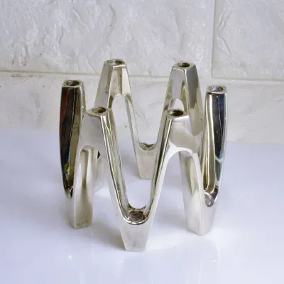 Sale Photo Thumbnail #245: Crown style set designed by Jens Quistgaard. 3" tall, meant to fit "tiny tapers". Can hold: 6 or 12 or one large ball candle. As found in box...scuffed This item is a Dansk "Design with Light" tiny taper candle holder, model number 9300 or 02125NP. It is 