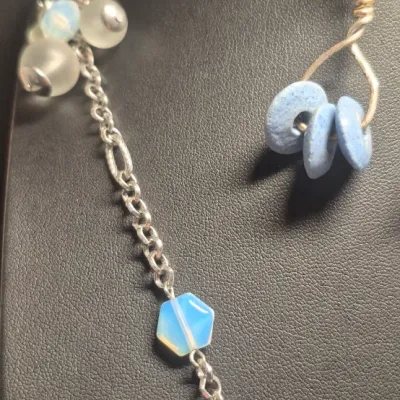 Sale Photo Thumbnail #98: Loft Silvertone w/baby blue bead clumps Necklace 16" & dangle Earrings match
versatile necklace with lobster clasp
all beads are present....16
Earrings are toned to match