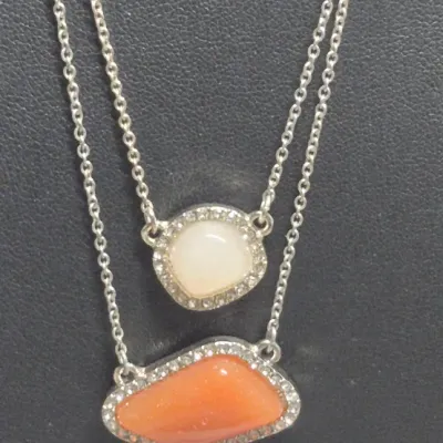 Sale Photo Thumbnail #117: Ann Taylor Sets ~ 2 Necklaces  & 9 pair Earrings
> Necklaces are a silver tone with two spaced Pendants agates w/ tag
> gold tone necklace has small rhinestones sparkling w/ tag
> 9 pair of delicate pairings and an enameled hoop style.... backs  pierced