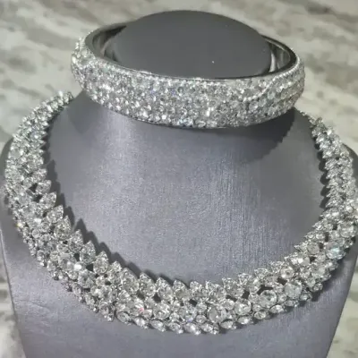 Sale Photo Thumbnail #300: Rhinestone set ~ cuff bedazzled & Necklace with 3 strands
Necklace is 3 strands of rhinestones, J-clasp
Cuff is solid no closure'
All great dazzle