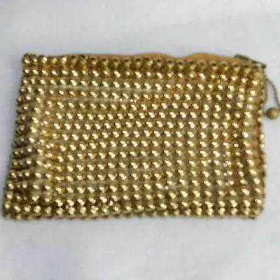 Sale Photo Thumbnail #340: Coin purse is attributed to Whiting & Davis and features a gold-tone mesh construction accented with gold beading and a secure zipper closure. The interior is lined with complimentary pink fabric. The piece measures approximately 4" H x 5" W x 1/4" D.....