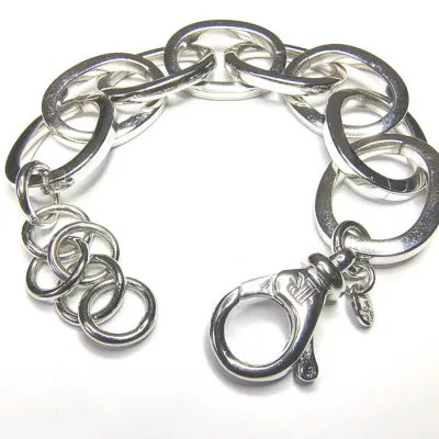Sale Photo Thumbnail #268: Ralph Lauren Silver Tone Round Triple Link Chain Bracelet. Condition is Pre-owned. 
> superb condition, no scratches
Size 8" with toggle clasp