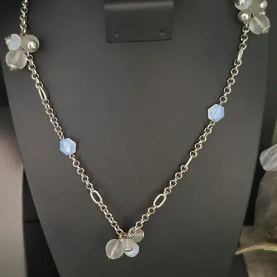 Sale Photo Thumbnail #97: Loft Silvertone w/baby blue bead clumps Necklace 16" & dangle Earrings match
versatile necklace with lobster clasp
all beads are present....16
Earrings are toned to match
