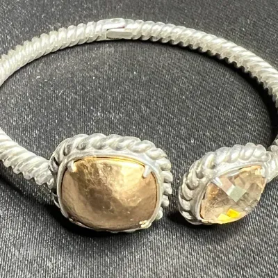 Sale Photo Thumbnail #150: Brighton pair of silver tone Bracelets ~ Juvelle & Onyx , [ pair ]
2 tone, gold plated ring around Onyx stones 7"dia, test sterling

STERLING TWO TONE LAB MADE QUARTZ HINGED 7" BANGLE 10MM BRACELET 32.3GR