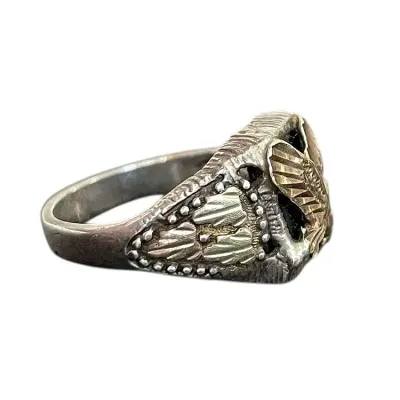Sale Photo Thumbnail #55: Black Hills Gold Eagle Ring, Sterling SilverA men's pinky ring featuring a gold appliqued eagle on the black onyx center, as well as gold leaves on the sides. The ring itself is sterling silver and marked 925. Size 6 3/4
Weight: 4.7 grams
Beautiful men's 