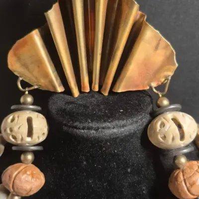 Sale Photo Thumbnail #362: Tribal Bohemian artisans Necklace with copper pleated fan



Bold statement, easy to wear not overpowering heavy



Pleated fan is the center point......16" overall