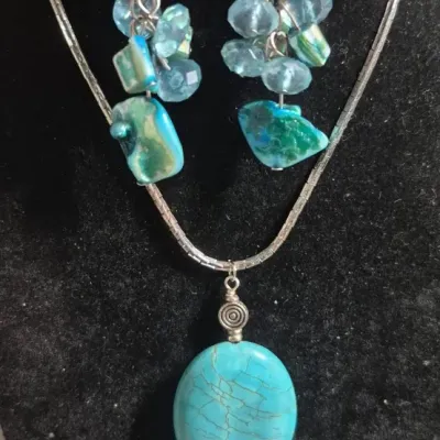 Sale Photo Thumbnail #195: SoHo smooth turquoise stone, silver tone Necklace & Earrings match
necklace is 14" on a square sterling chain...fabby and marked on the clasp

Earrings are unbranded but match as set