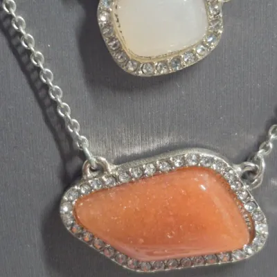 Sale Photo Thumbnail #118: Ann Taylor Sets ~ 2 Necklaces  & 9 pair Earrings
> Necklaces are a silver tone with two spaced Pendants agates w/ tag
> gold tone necklace has small rhinestones sparkling w/ tag
> 9 pair of delicate pairings and an enameled hoop style.... backs  pierced
