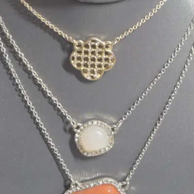 Sale Photo Thumbnail #116: Ann Taylor Sets ~ 2 Necklaces  & 9 pair Earrings
> Necklaces are a silver tone with two spaced Pendants agates w/ tag
> gold tone necklace has small rhinestones sparkling w/ tag
> 9 pair of delicate pairings and an enameled hoop style.... backs  pierced