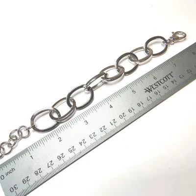 Sale Photo Thumbnail #271: Ralph Lauren Silver Tone Round Triple Link Chain Bracelet. Condition is Pre-owned. 
> superb condition, no scratches
Size 8" with toggle clasp