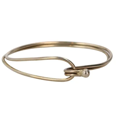 Sale Photo Thumbnail #144: Sterling Wire Hook Bracelet 8.5g ........size 6.25
pass thru hook works properly
Note:  sterling [not gold as light photo shows]