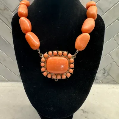 Sale Photo Thumbnail #373: Bold Orange beaded pendant necklace
overall size 10" w/lobster clasp
weighty chunky beads with center oval pendant