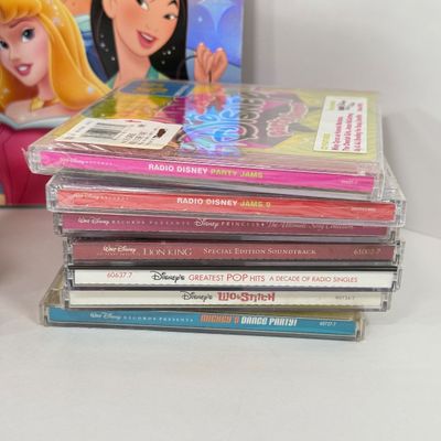 LOT 79A: Disney CDs, On Ice Princess Classics Program & Disney DVDs: Cinderella, Lilo & Stitch, Aladdin, Beauty and the Beast,...