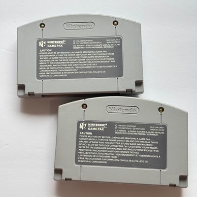 LOT 205V: Vintage Nintendo N64 Video Game Consoles: 007, Wayne Gretzky & More