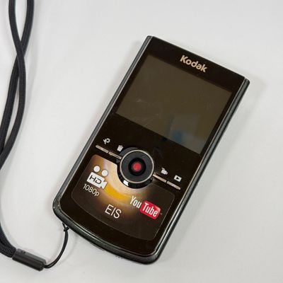 LOT 71A: Kodak Zi8 Pocket Video Camera w Box, Manuals, Charger & Cords