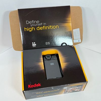 LOT 71A: Kodak Zi8 Pocket Video Camera w Box, Manuals, Charger & Cords