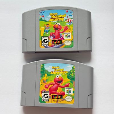 LOT 201V: Vintage Nintendo N64 Video Game Cartridges: Pokémon Stadium, Mario Kart 64, Paper Boy, Toy Story 2, Rugrats in Paris & Elmo...