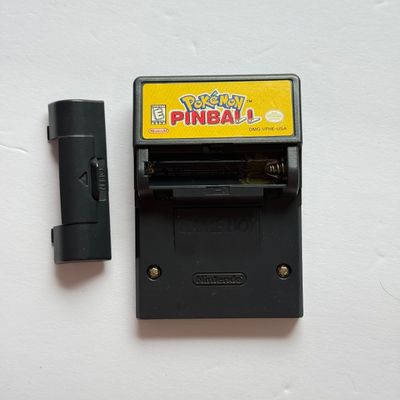 LOT 203V: Vintage Nintendo GameBoy Games & Accessories: Tamagotchi, Wayne's World, Power Quest, N64 Adapter & Clip-on Lighting