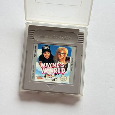 LOT 203V: Vintage Nintendo GameBoy Games & Accessories: Tamagotchi, Wayne's World, Power Quest, N64 Adapter & Clip-on Lighting